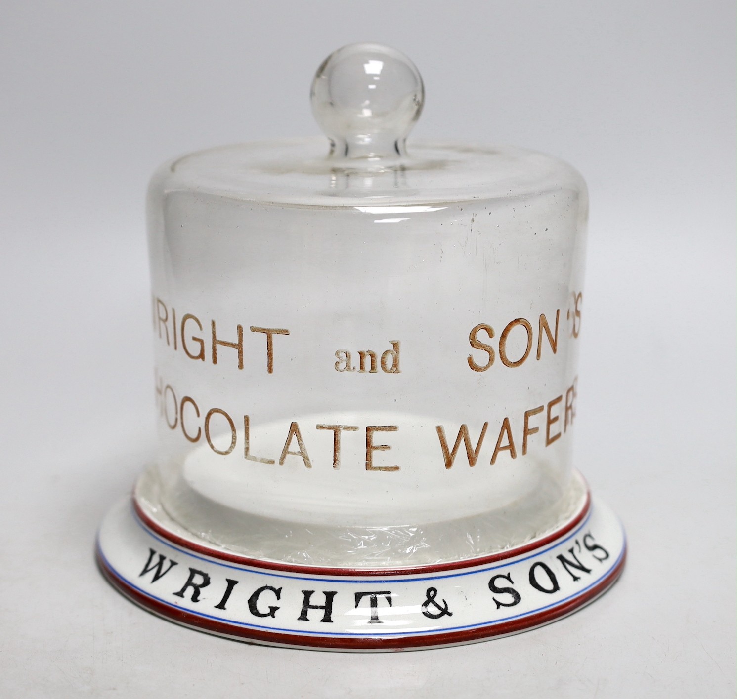 A Wright & Son’s Wafers display pottery stand with glass dome. 19cm tall overall